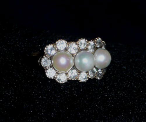 Edwardian 14k Diamond & Pearl ring: Edwardian 14k Diamond & Pearl ring with line of 3 pearls framed by 16 full diamonds. Marked 14k. Weight: 3.9g Condition: Excellent Provenance: Private estate