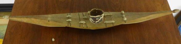Inuit Sealskin Kayak, Bone & Teeth Decoration: Inuit Sealskin Kayak, Bone & Teeth Decoration. Early 20th C. Length: 23" Condition: Very good. Loss to 1string with teeth decoration. Provenance: Private estate