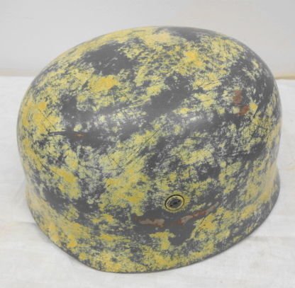 German Nazi WW 2 Paratrooper Helmet, Afrika Korps: German Nazi WW 2 Paratrooper Helmet, Afrika Korps. Steel helmet with leather liner and chin harness intact. Outer surface shows field wear with paintloss to the sandy yellow (desert) paint. Remnants o