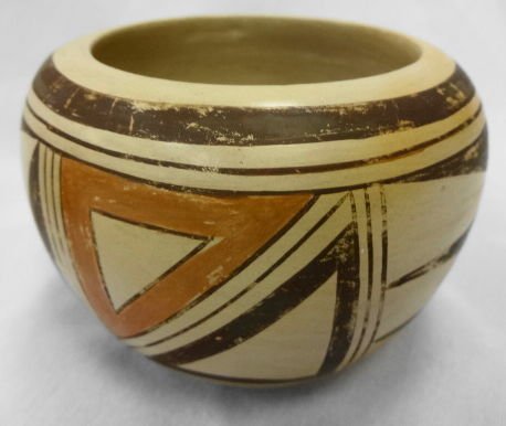 Native American Polychrome Bowl: Native American Polychrome Bowl. Chocolate and red geometric decoration on white ground with a 2 band border in chocolate on top & bottom. Bowl is intact with some minor fading to paint and scratching