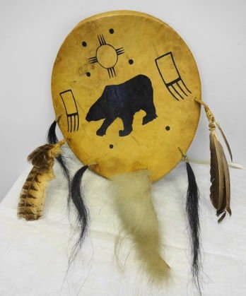 Inuit Painted Ceremonial Shield: Inuit Painted Animal Hide Ceremonial Shield. Hand Made with Bird Feathers and Animal Tails surrounding shield. Size: 16" x 15" Condition: Very good, some cracks show but no splitting or sepearation to