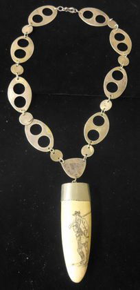 Coin Silver Chain & Scrimshaw Tooth: R. Frye (Gun smith maker), designed chain and walrus scrimshaw signed tooth. Size: 13-1/2" long. Chain design Large links 1" x 1-1/2" .Condition: Very good Provenance: Private collector IVORY CANNOT B