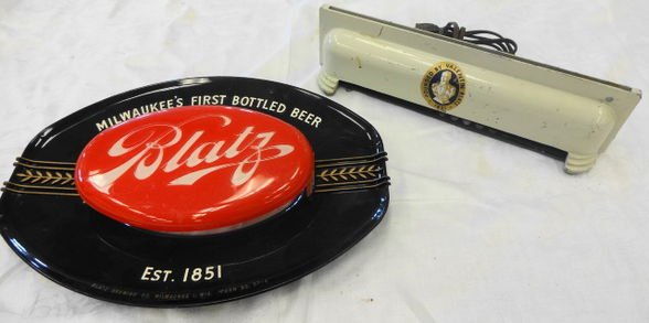 Blatz Beer Deco Sign Base and Plastic Sign Front: Blatz Beer Deco metal sign base and oval plastic sign front. Metal base measures 12 3/4" x 3 1/2" x 3 3/4". Would hold a glass panel. 2 bulb lighting. Provenance: Hudson Valley Estate.