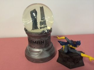 Batgirl Mini and Batman Snowglobe, DC Direct: DC direct, Limited Edition of 0828/3000 and 2717/3000, hand painted and cold-cast porcelain statues. Sculptors: William Paquet and Tim Bruckner Marked on the bottom: 1999 DC Comics Dimension: 7-1/4" H