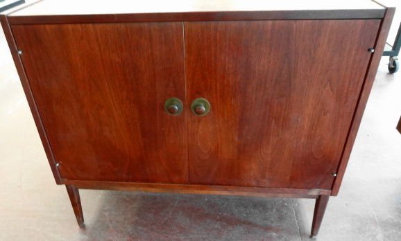 Mid Century Modern 2 Door Cabinet: Mid Century 2 Door Cabinet with shelfUnmarked.Dimensions: 36" (W) x 18" (D) x 30 1/4" (H)Condition: Very good, no scratching or damage noted.Provenance: Private estate