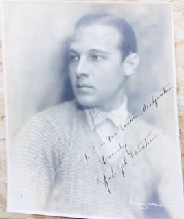 Rudolph Valentino Autographed Photoprint: Rudolph Valentino Autographed Photoprint Rudolph Valentino, (1895 - 1926) American silent film star of legendary status, a romantic leading man and star of The Sheik. Signed & Inscribed: "To Our Far E