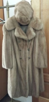Champagne Mink Fur Coat and Hat: Double Breasted closure. Kleinfeld & Son label.Lenth: 40"; Shoulders: 16"Condition: Excellent estate found condition. Lining is clean and completely intact. Provenance: Private estate