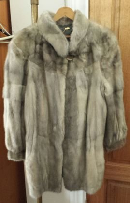 Gray Mink Fur Coat.: Length:34"; Shoulders: 18"Condition: Good estate found condition. There is a 2" split in the pelts on the left upper back area. See photo. Lining intact and clean.Provenance: Private estate.