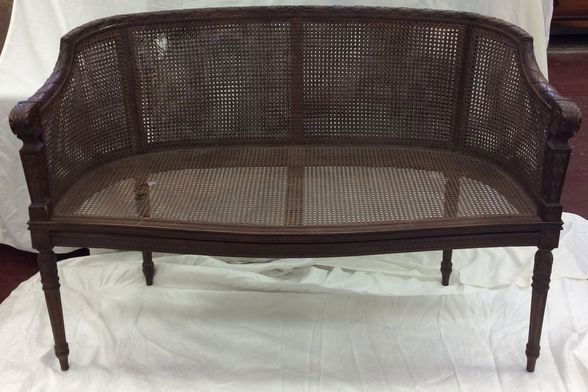 French Provincial Double Caned Settee.: Dimensions: 49" x 33" x 23 1/2". Condition: Estate found condition. Some imperfections to cane on seat and back. See photos.Provenance: New Jerey estate
