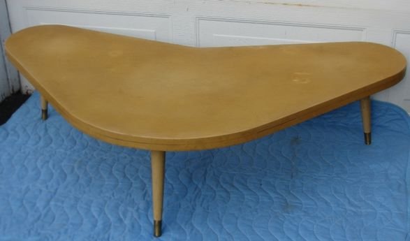 Mid Century Modern Boomerang Coffee Table: Blonde finished wooden table. Dimensions: 60" x 34" x 15.5" Condition: Good estate found condition.Some wear to finish appropriate for age and use. Provenance: Private estate