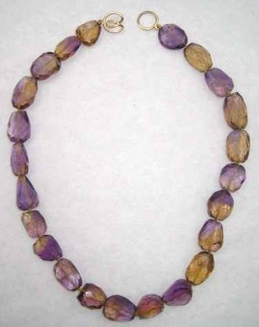 255: Vintage 14 K Gold clasp faceted amethyst necklace: faceted amethyst 14 K Gold clasps necklace. style of angela cummings.