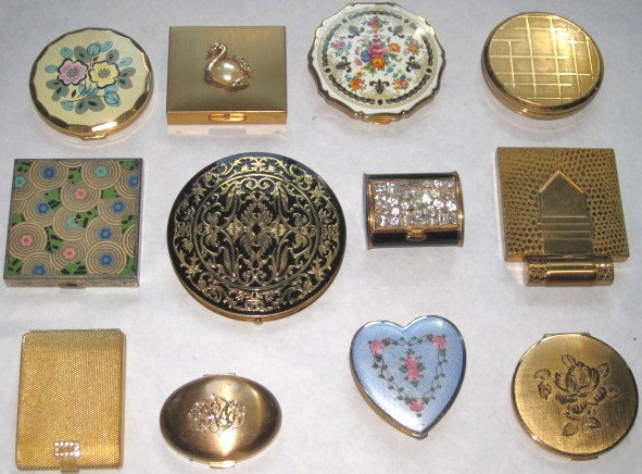 12 Assorted gold metal and silver plate compacts: Including Dorothy Gray, Mascot, Stratton, Volupte, Fifth Rex Avenue, etc Fair condition, some new