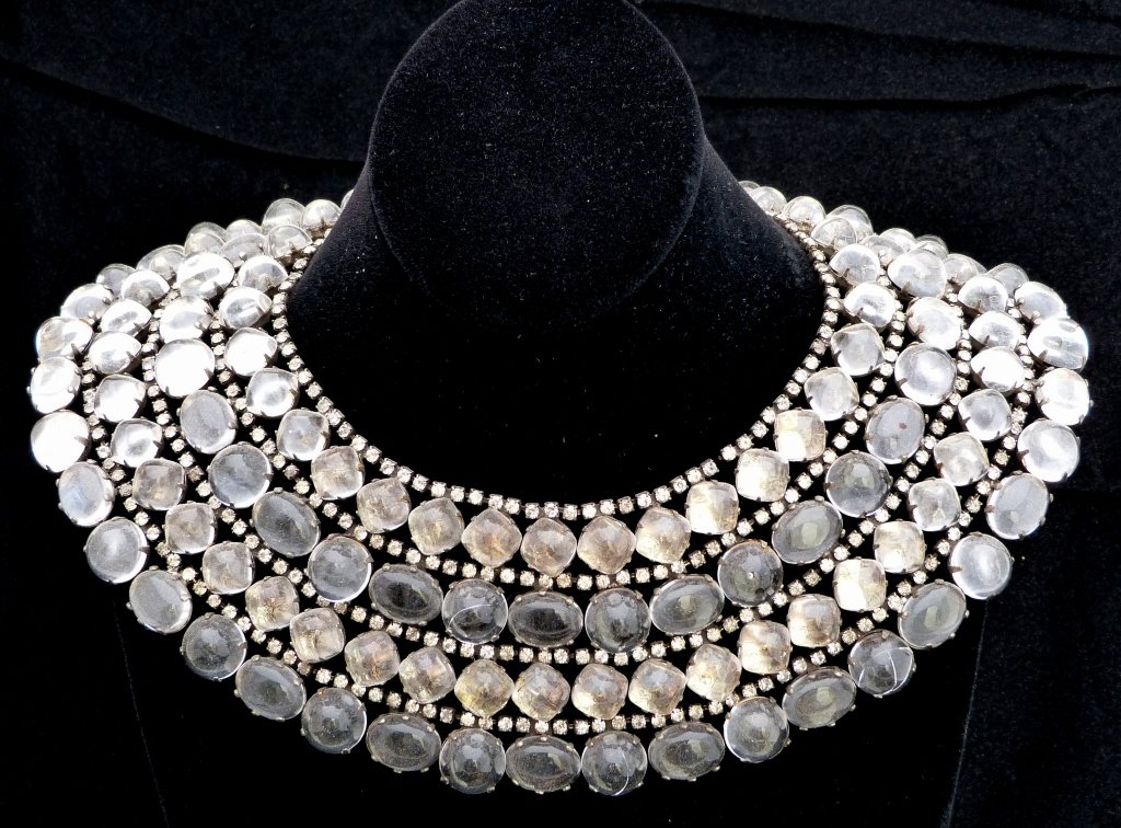 Kenneth Jay Lane Bib Necklace: Faux rock crystal necklace with three stones missing in the back. Marked Kenneth Jay Lane Sterling.