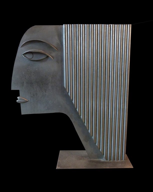 Franz Hagenauer Sculpture: Stylized head of a woman with applied details, polished steel, stamped with logo and Hagenauer Wien made in Austria. the sculpture measures at 21 inches in height.