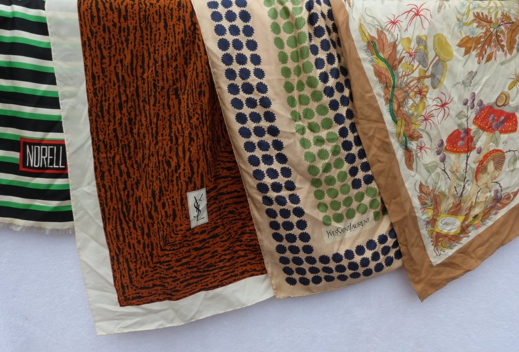 Four Vintage Scarves incl. Gucci: Four Scarves two by Yves Saint Laurent, one Gucci, and one by Norell.