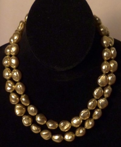 Miriam Haskell Pearl Necklace: Double graduated strands of baroque pearls with a golden sheen.