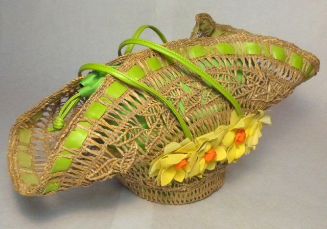 Moschino Woven Straw and Leather Handbag: With Leather Flower Embellishments. Excellent condition,with original price tag.