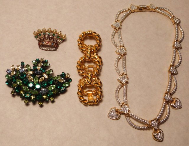 Trifari Crown Sterling,Marked Bracelet,Necklace,Pendant: one TRIFARI CROWN STERLING PIN marked, one rhinestone decorated necklace, , green stone decorated pendant, one gold tone link bracelet. good condition