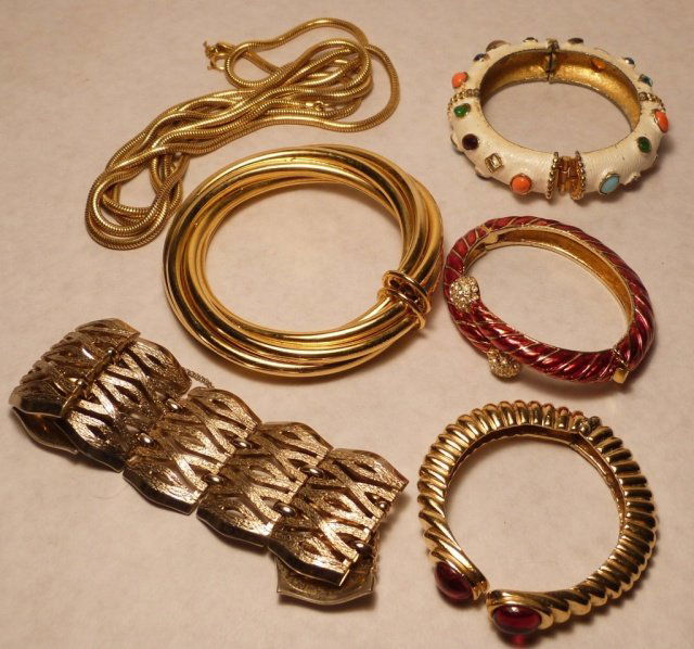 Kenneth Jay Lane, Ciner, Monet, bangle, Chain: Comprising two bangles, a bracelet, and a chain. one kenneth jay lane enamel white with colorful stones, marked K.J.L. one ciner bangle marked, one monet wide chain bracelet, marked, one chain. good c