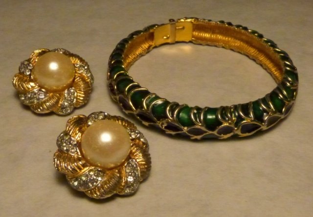 Kenneth Jay Lane Ear Clips & Bracelet: (1) Faux pearl, gold, and rhinestone button ear clips. (2) Enamel black, green, and gold bracelet.