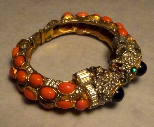 Kenneth Jay Lane "Fantasié Dragon" Bracelet: Kenneth Jay Lane Coral, Black, and Gold, and Diamonté "Fantasié Dragon" bracelet. Missing one stone.
