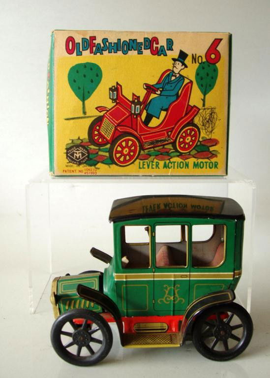 VINTAGE LITHO-TIN TOY CAR MIB: 1950's Japanese tin 'Old Fashioned Car No. 6' Trade Mark Modern Toys. Approx 6"long. Lever set. Comes with orig box. Car missing steering wheel otherwise in vg condition. Works well when tested. Box a