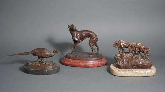 THREE BRONZES OF ANIMALS EACH MOUNTED ON A MARBLE BASE: Including two in the style of P.J. MeneComprising a pheasant with the inscription "P.J. Mene" a greyhound inscrbed "P.J. Mene" and two buffalo on an outcropping inscribed "C.M.R." (Charles M. Russel)