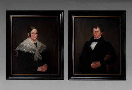 PAIR OF PORTRAITS OF A LADY AND GENTLEMAN: American, circa 1845  Each seated in canned-back chair with crossed hands. Each portrait retaining its original white pine stretcher and coved, black and gold painted white pine frame with gilt liner