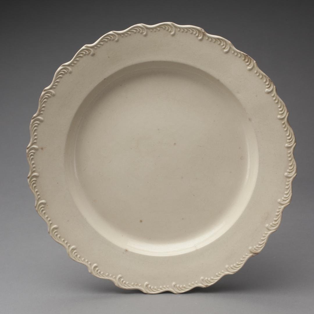 A CREAMWARE CHARGER WITH SCALLOP SHELL-EDGE (1 of 8)