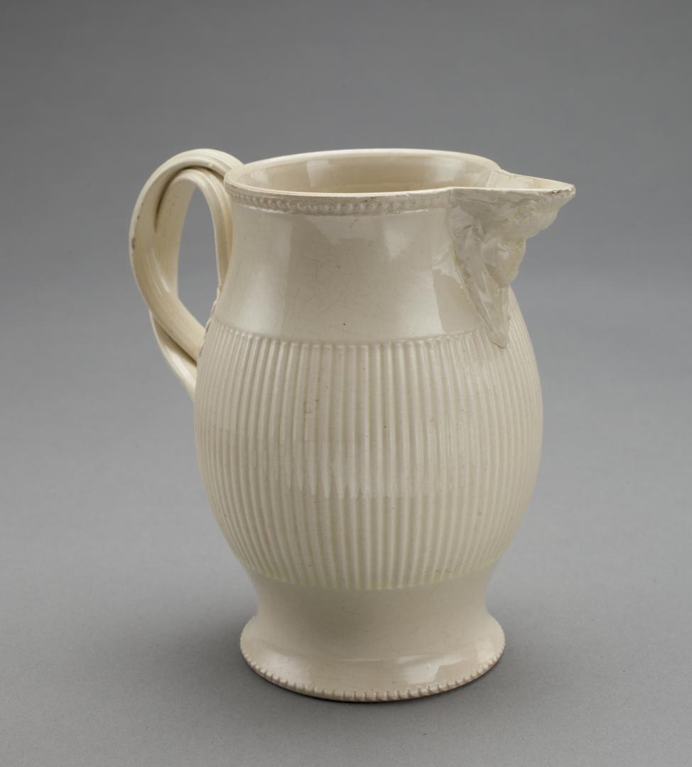 CREAMWARE PITCHER W/ RIBBED BODY AND FACE MASK SPOUT (1 of 13)