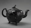 A JACKFIELD POTTERY THREE-FOOTED TEA POT ENGLISH,