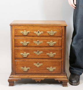 Rare Diminutive Chippendale Chest of Drawers: Probably Southeastern Connecticut, 1765-1785 Cherrywood chest with rectangular top with molded edge over four graduated drawers, each with original batwing brasses, flanked by twisted columns, ogee