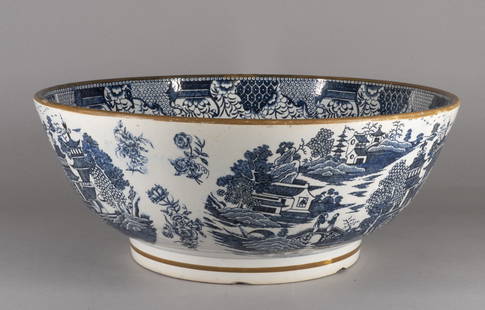 Large Staffordshire Pearlware Punch Bowl: Late 18th / early 19th century Blue and white transfer decoration with three vignettes of a Chinoiserie landscape version of Willow pattern, the interior rim with a stylized foliate scroll