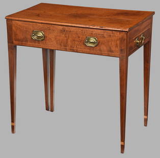 Rare Southern Inlaid Mahogany Writing Table: Probably Savannah area, 1790-1810 With an inlaid molded top hinged at center opening to fitted writing desk with ratcheted writing board, flanked by fittings for ink and pens, over highly figured