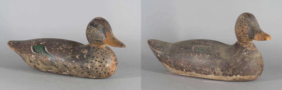 Two Factory Decoys: Circa 1920 Carved and painted wood decoy birds. L. 15 1/2 in. Condition: As found, losses and abrasions, one has considerable loss to beak.