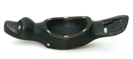 A Northwest Coast Carved Seal Form Bowl: A Northwest Coast Carved Seal Form Bowl Tlingit, likely Sitka, AK, early 20th century With Abalone inset decoration. Grease bowls were made to contain edible oils used as an accompaniment to the dried