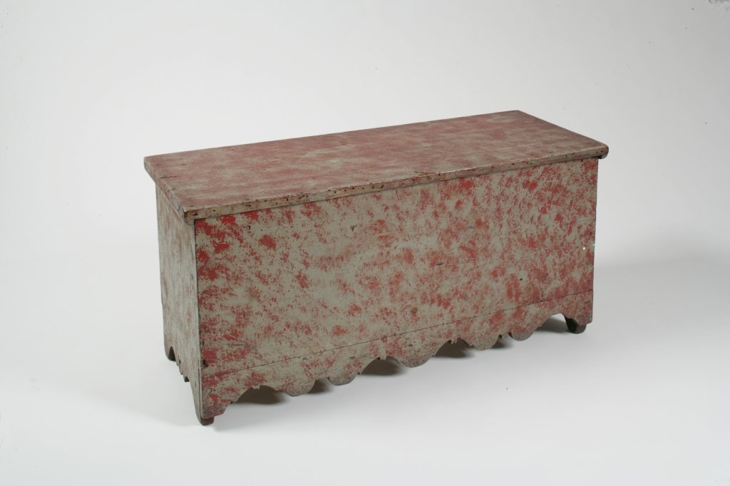 Child's Red and Grey Painted Lift-Top Blanket Chest: Chest with Scalloped Skirt American, first half 19th century H. 15 in.; W. 31 3/4 in.; D. 12 1/4 in. Estimate: $300 - $600 Condition: Condition: skirt retains its original configuration and did not or