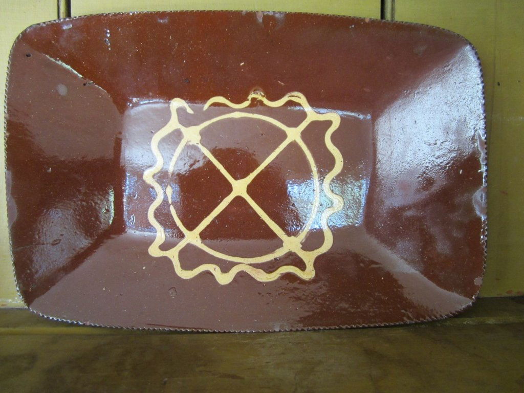 Two Slip- Decorated Redware Rectangular Trays: Huntington, New York, early 19th century Each with geometric and wavy line decoration (2) Estimate: $1,200 - $1,800 Collectors Joanne and Jeffrey Klein enjoy the eclectic mix of American folk art, pai