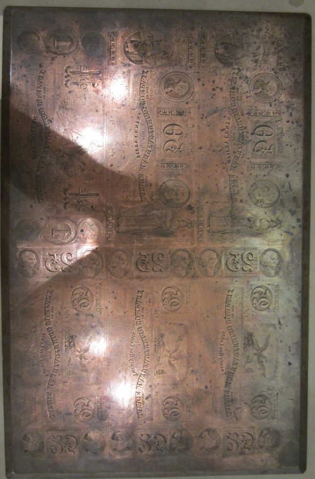 Engraved Copper Plate for Printing Currency: American, late 19th century Engraved: ÒSTORE OF THE SAVAGE MANUFACTURING COMPANYÓ in denominations of twenty-five cents, fifty cents and one-dollar for bill prints. 9 _ x 14 1/8 inches Provenance: F