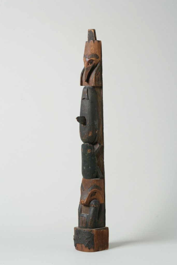Carved and Painted Wooden Northwest Coast Indian Totem: Property of a Private Collector Carved and Painted Wooden Northwest Coast Indian Totem Pole Early 20th Century American, Northwest Coast Figures including: frog, whale and bear H. 24 ¾ inches; W. (at