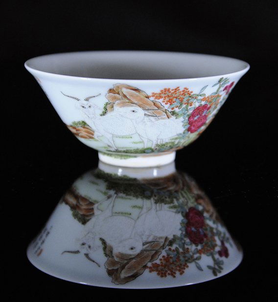 A famille-rose three ram cupMark and period of Da: Date: "Qing Daoguang." Title: "A famille-rose three ram cupMark and period of Daoguang." Description: A well painted color coordination with three lambs in landscape scene. A poem with three stamps. S