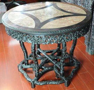 Late Qing / Republic. A rose-wood insert marble c: Late Qing / Republic. A rose-wood insert marble carved ‘Flower and birds’ round table 97 x 76.5 cm. (38 1/8 x 30 1/8 in.) 民國 紅木雕梅花喜鵲&