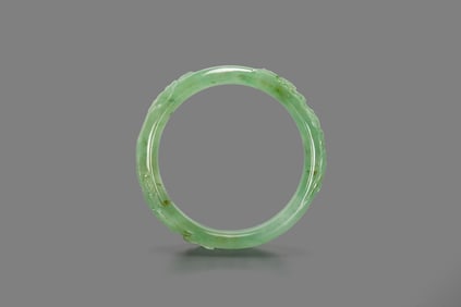 A Semi-Translucent Jadeite Bangle.