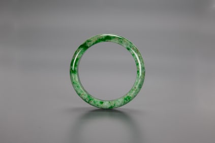 A Peas Green Jadeite Bangle.