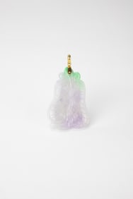 A Lavender Green Jadeite Carved ‘Fan’ Shape Pendant.