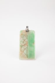 A Green Jadeite Carved ‘Weath Flower Blossom ‘ Pendant.