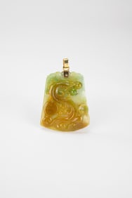A Yellowish Jadeite Carved ‘Dragon’ Pendnt