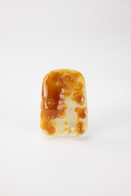 A Yellowish Jadeite Carved ‘Flowers’ Pendant