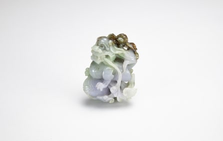 A Lavender And Green Jadeite Carved ‘Beast’ Pendant
