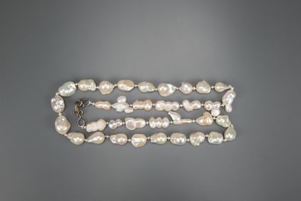 A Thirty Four Beads Natural Pearl Necklace